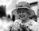 Her Royal Highness Queen Elizabeth the second carrying a bunch of flowers given to her on a visit to North Somerset