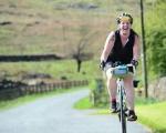 woman cycling on a country road