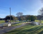 A photo of Portishead Lake Grounds showing the lake and children's play area