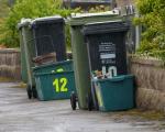 Recycling and rubbish bins ready for collection on the kerbside