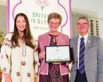 A photo of TV gardening personality Rachel de Thame presenting a certificate to representatives from Portishead in Bloom at the Britain in Bloom Awards 2022.