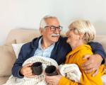 Couple drinking whilst keeping warm