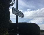 A photo of a direction road sign pointing towards Backwell Recycling Centre