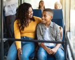 A mother and son on a bus