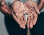 hands holding with a key in the palm