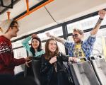 Happy young people on a bus