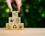 Pile of wooden cubes with net zero logos