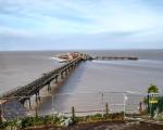 A photo taken of Birnbeck Pier from the road above looking out to sea