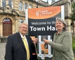 Cllr Wendy Griggs hands chains of office to Cllr Peter Crew