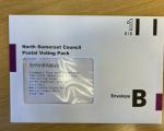 North Somerset Council postal voting pack on a wooden table top