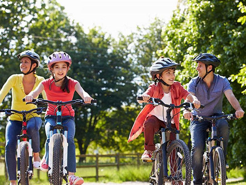 A group of people riding bikes