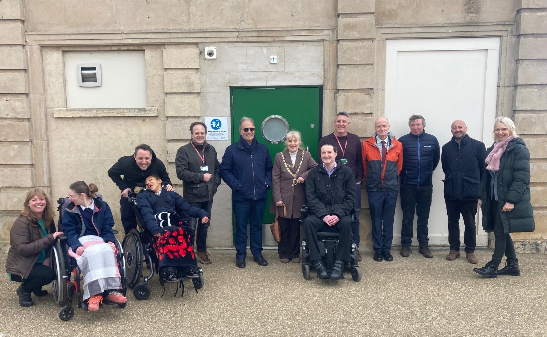 A photo of all those who attended the official opening of the Changing Places toilet at the Tropicana.