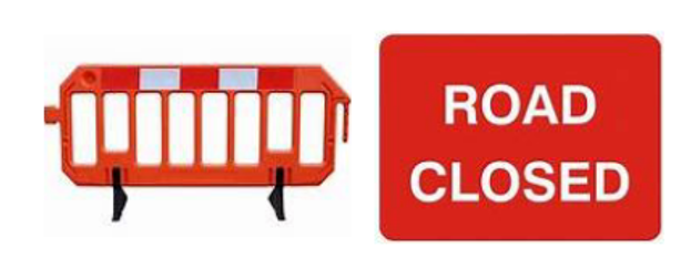 A red barrier and a sign with a red background that says road closed in white letters.