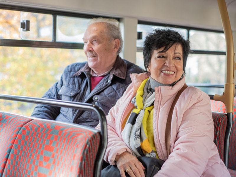 An older couple on a bus