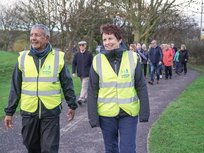 Walking group in high vis vests