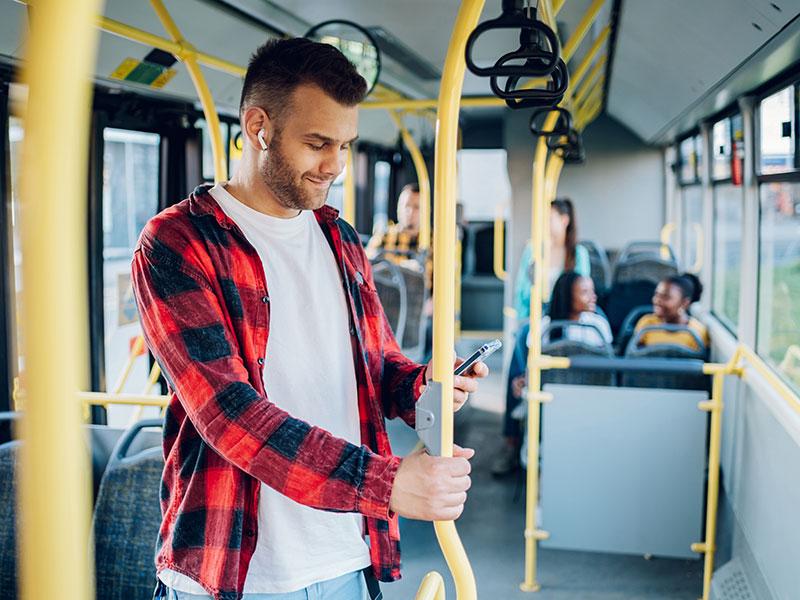 Young man travelling on a bus