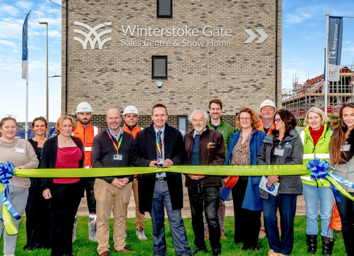 Cllr Mike Bell cutting the ribbon the first show home at Winterstoke Gate in Parklands Village