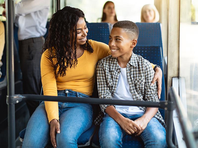 A mother and son on a bus