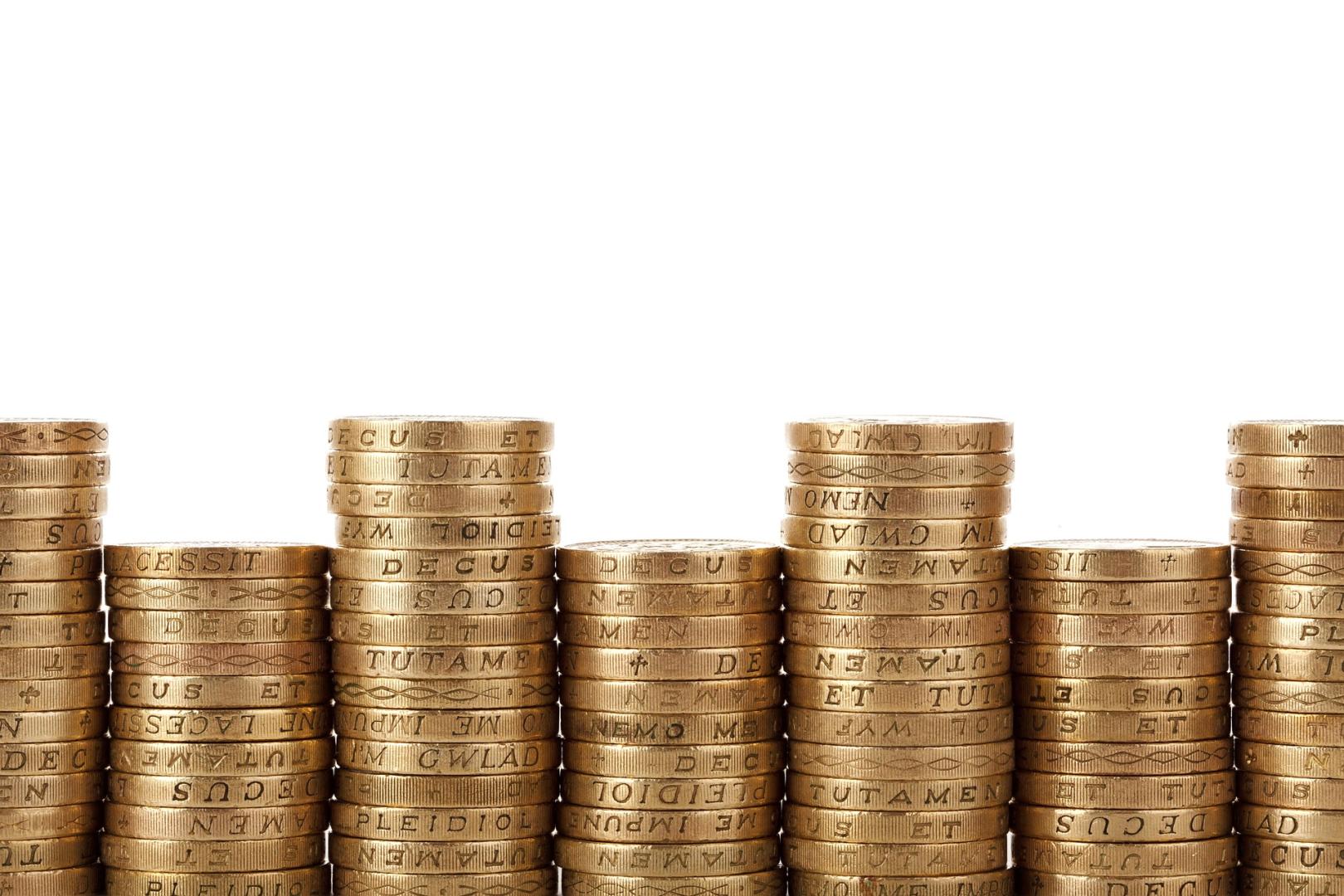 A row of stacked pound coins