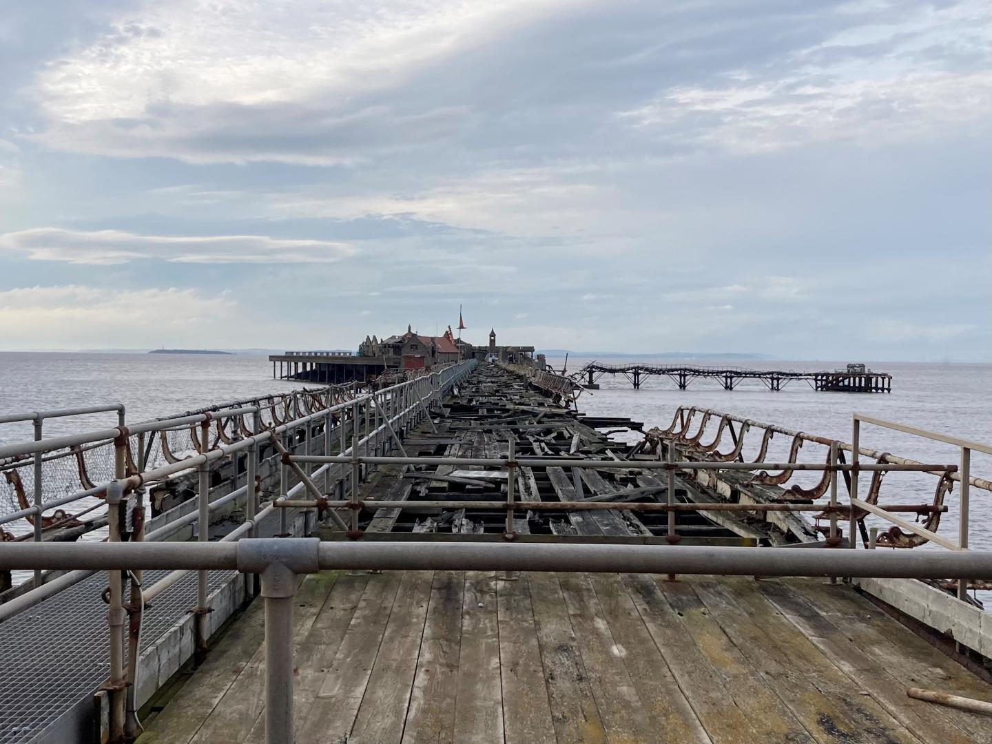 A photo of Birnbeck Pier taken in October 2024 showing the state of disrepair before restoration work starts