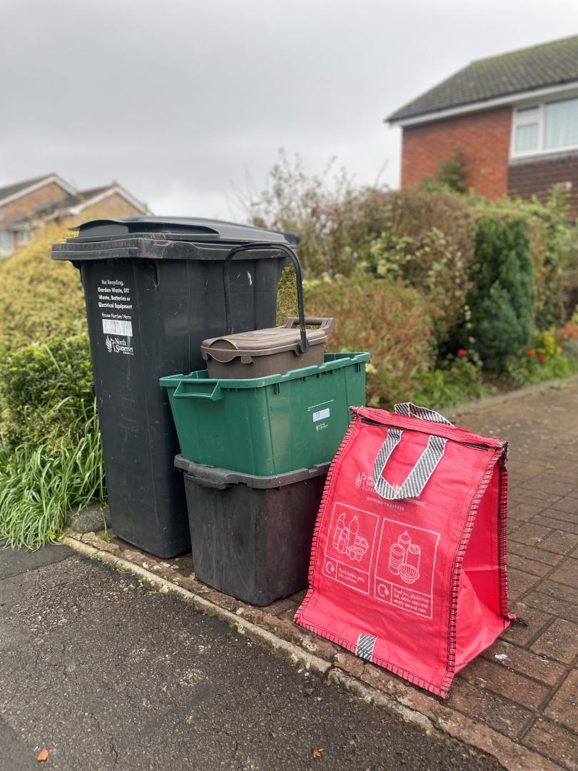 Full waste container set including red recycling bag