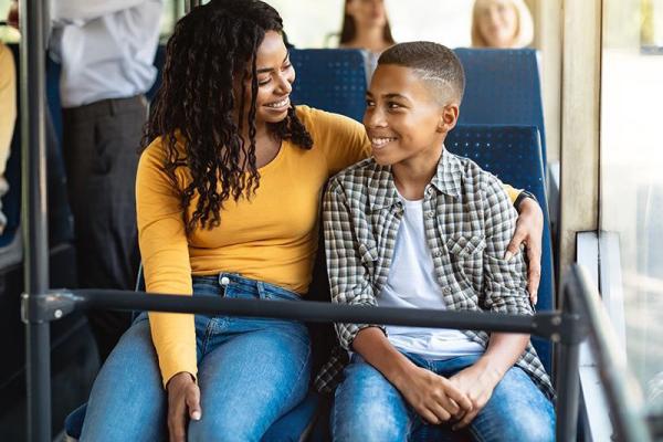 A mother and son on a bus